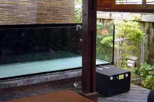 Aquarium chiller besides a fish tank