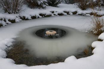 Pond deicer in use during winter preventing full surface freeze