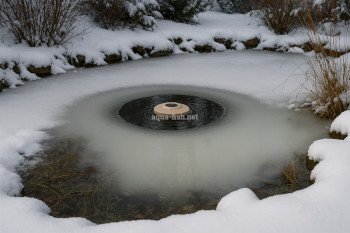 Pond deicer in use during winter preventing full surface freeze